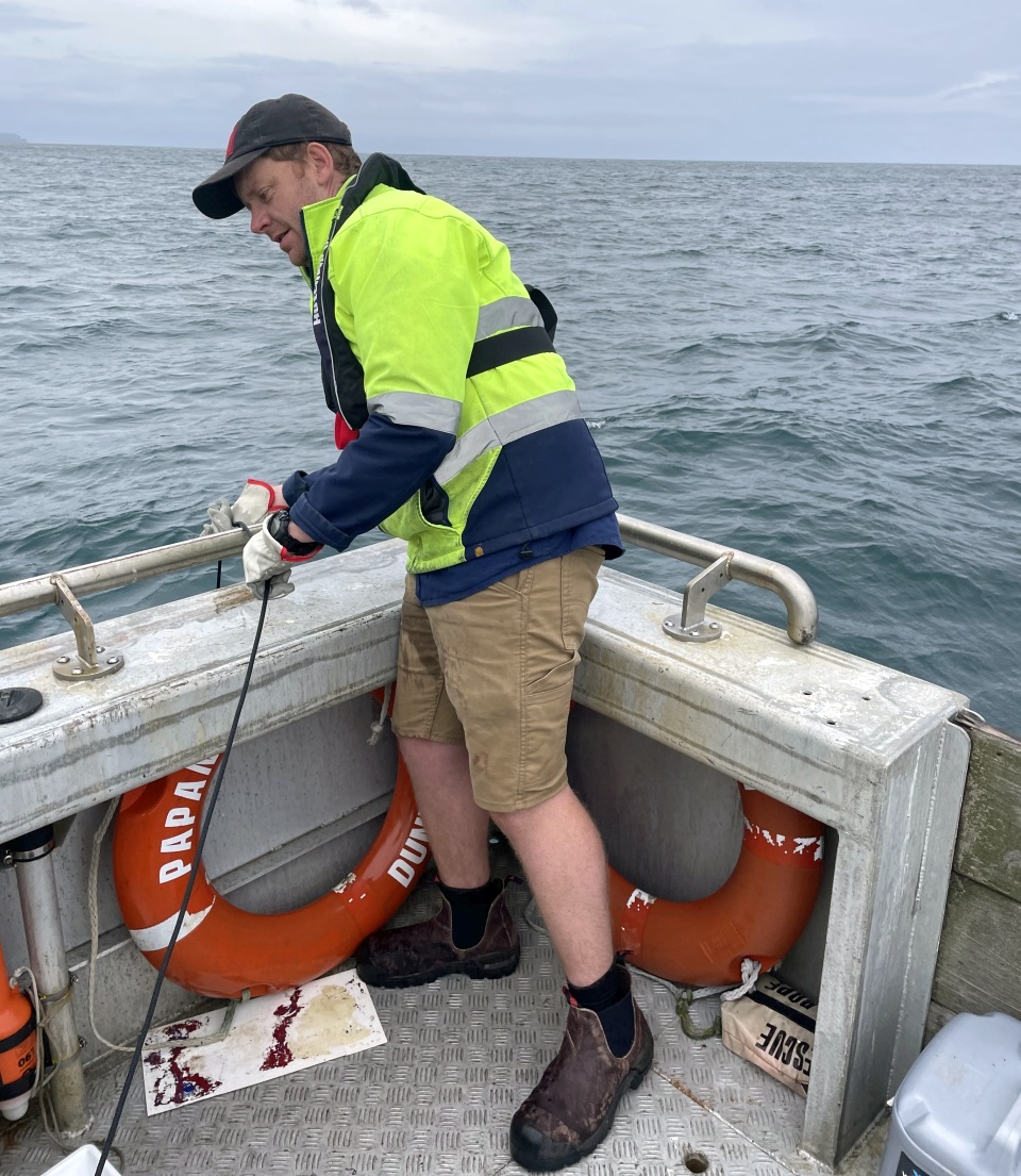 Hayes conducting seabed samples off the coast of St Clair Beach, Dunedin. Image: DML.