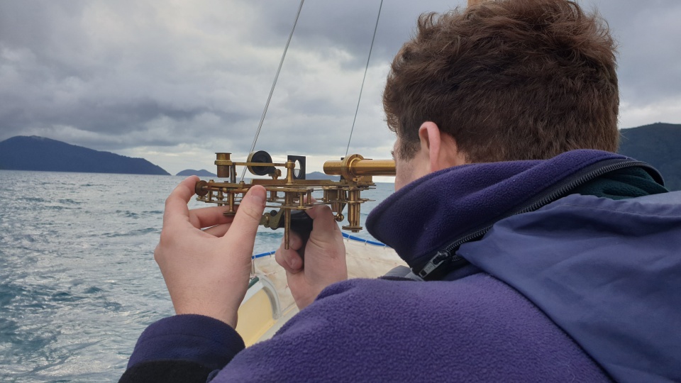 Virtual field trip expert Brad from Toitū Te Whenua Land Information New Zealand, seen here using a sextant; one of Captain Cook's key pieces of navigation equipment. Image: LEARNZ.